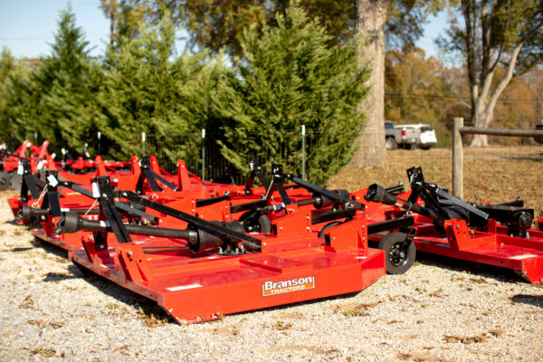 Multiple Branson cutters sir on display at Mathis Trailers and Equipment Sales.